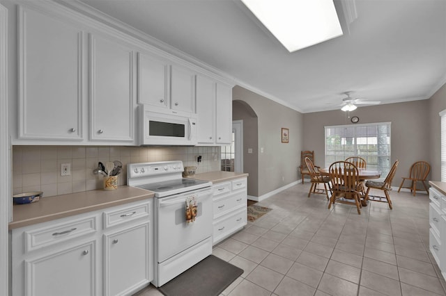 kitchen featuring ceiling fan, light tile patterned floors, white appliances, and white cabinets