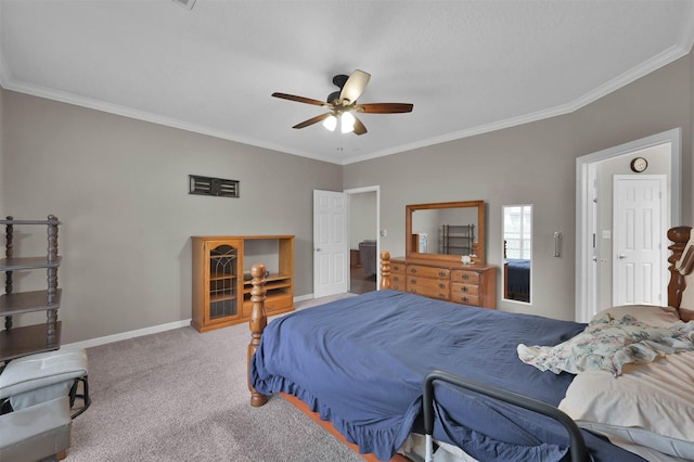 carpeted bedroom featuring ceiling fan and ornamental molding