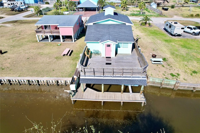 drone / aerial view with a water view