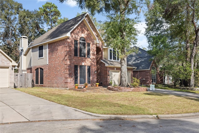 front facade with a garage and a front yard