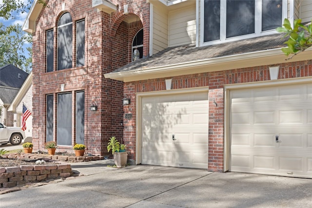 view of exterior entry with a garage