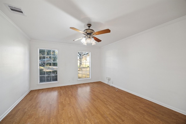 spare room with ornamental molding, hardwood / wood-style floors, and ceiling fan