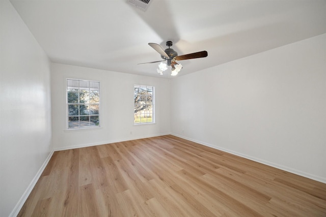 spare room with light hardwood / wood-style flooring and ceiling fan