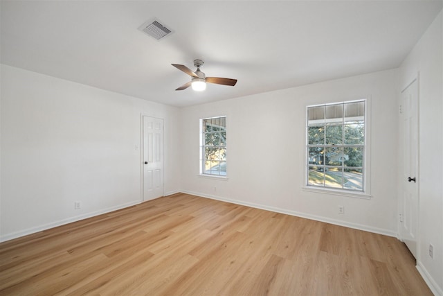 unfurnished room featuring ceiling fan and light wood-type flooring