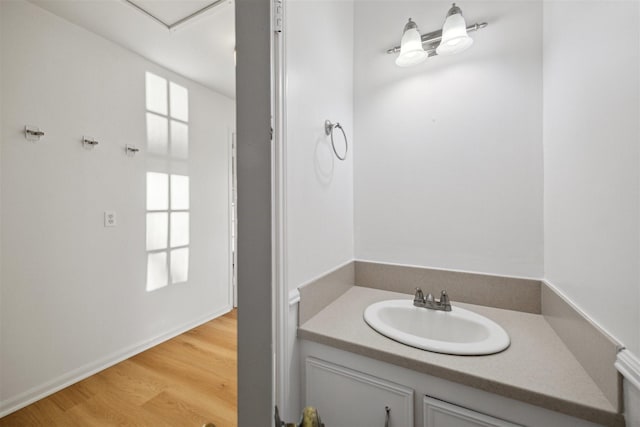 bathroom with vanity and hardwood / wood-style flooring