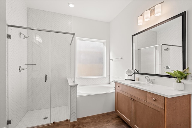 bathroom featuring vanity and separate shower and tub