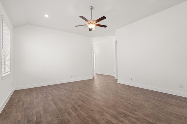 unfurnished room featuring ceiling fan, dark wood-type flooring, and vaulted ceiling