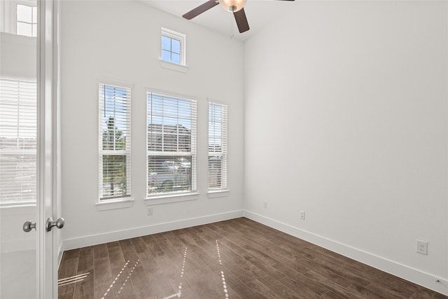 spare room featuring ceiling fan and dark hardwood / wood-style floors