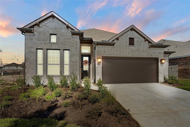 view of front of property featuring a garage