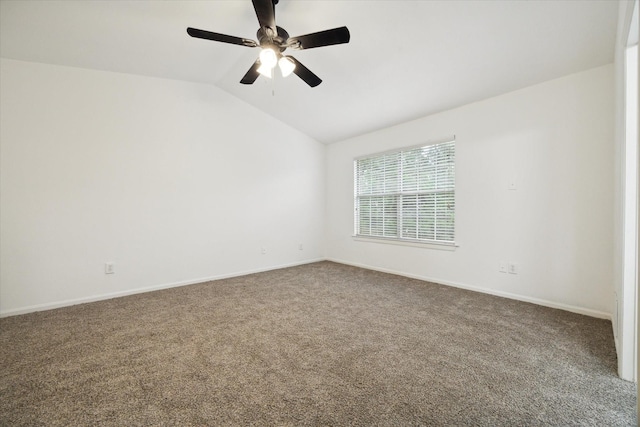 carpeted empty room with ceiling fan and vaulted ceiling