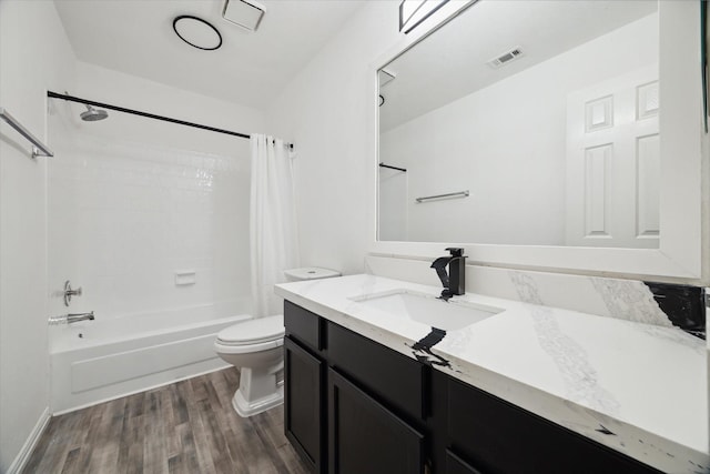 full bathroom with toilet, shower / bathtub combination with curtain, wood-type flooring, and vanity