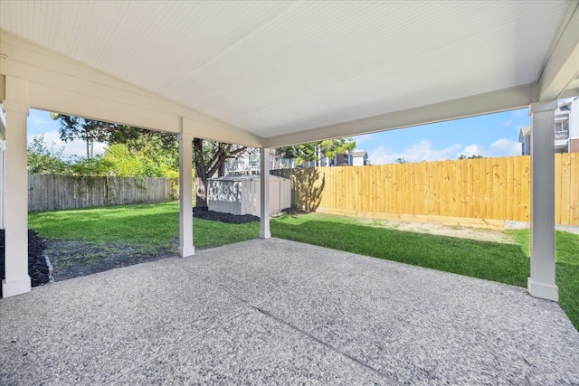 view of patio with a shed