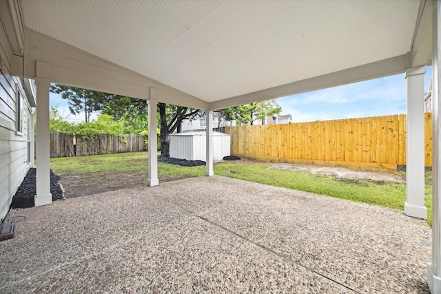 view of patio with a shed