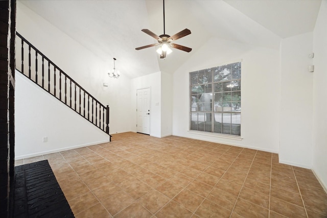 unfurnished living room featuring vaulted ceiling, light tile patterned floors, and ceiling fan with notable chandelier