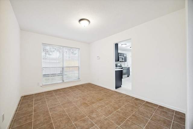 empty room featuring tile patterned floors