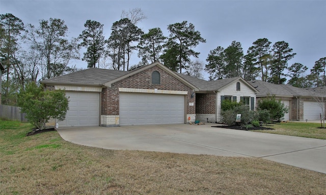 single story home featuring a garage and a front yard