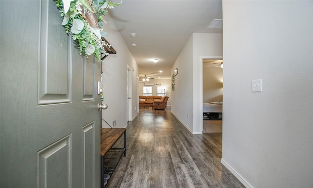 corridor with dark wood-type flooring