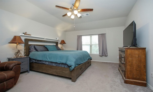 bedroom featuring ceiling fan, light colored carpet, and lofted ceiling