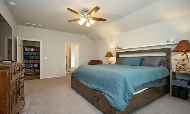 carpeted bedroom with vaulted ceiling, ceiling fan, and connected bathroom