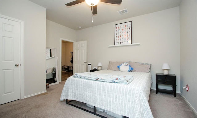 carpeted bedroom featuring ceiling fan