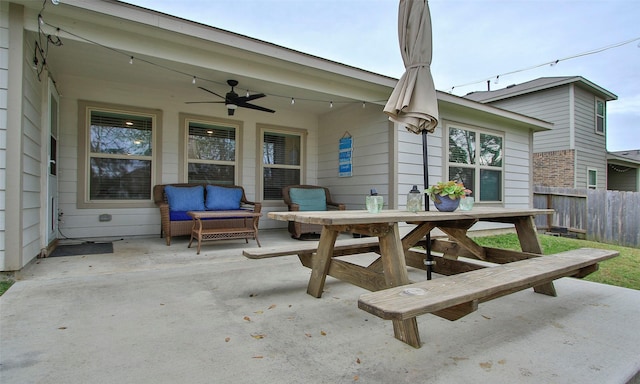 view of patio / terrace featuring ceiling fan and an outdoor living space