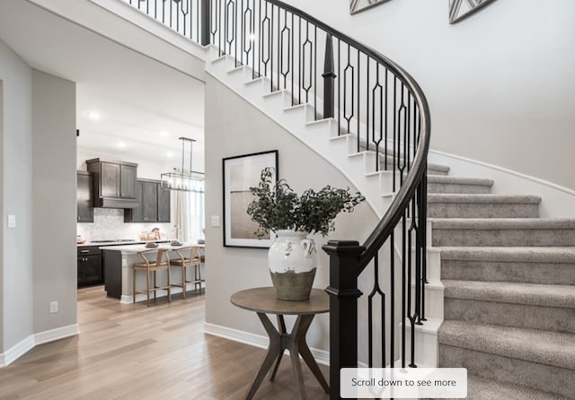 stairs featuring hardwood / wood-style flooring