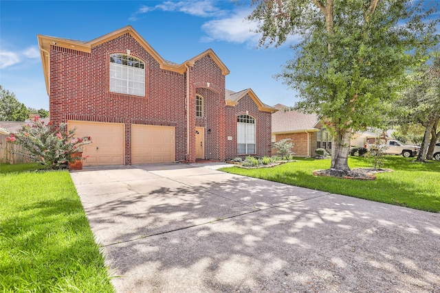 view of front property featuring a garage and a front yard