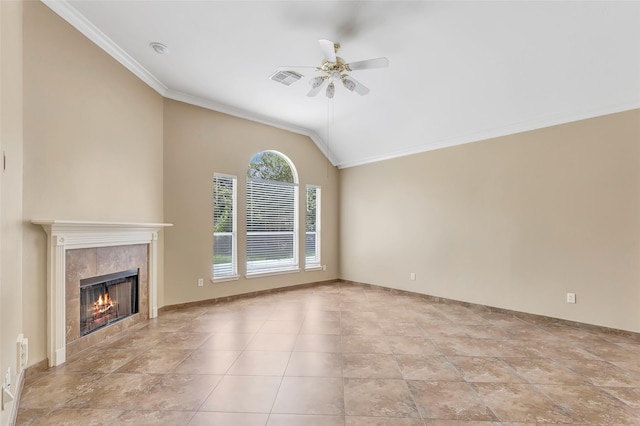 unfurnished living room with vaulted ceiling, ceiling fan, a high end fireplace, and ornamental molding