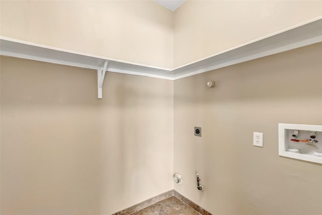 clothes washing area with washer hookup, tile patterned flooring, gas dryer hookup, and hookup for an electric dryer