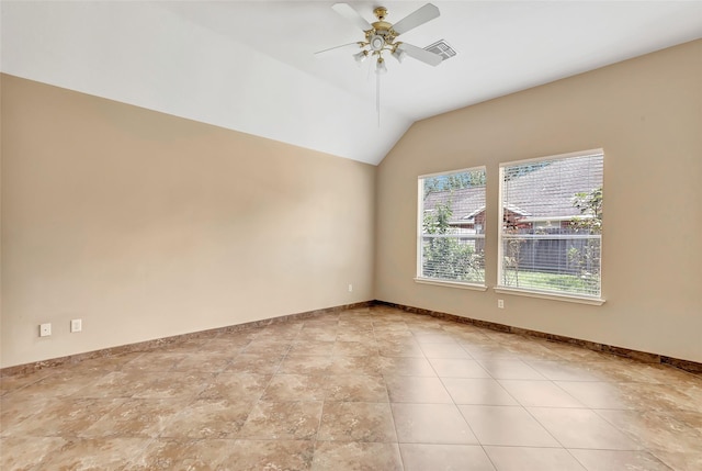 spare room featuring vaulted ceiling and ceiling fan