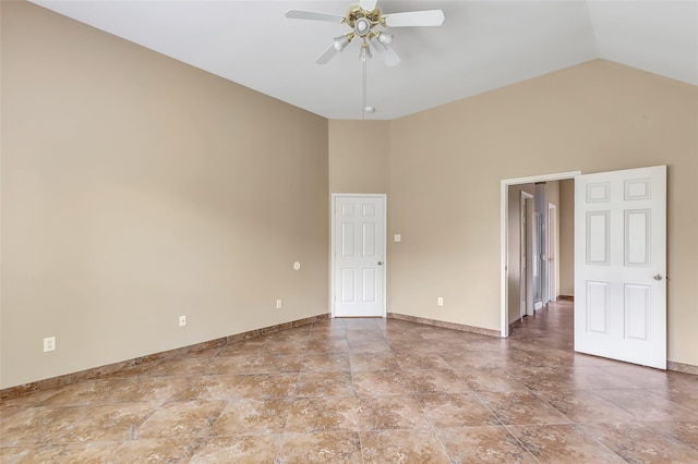 unfurnished room with ceiling fan and high vaulted ceiling