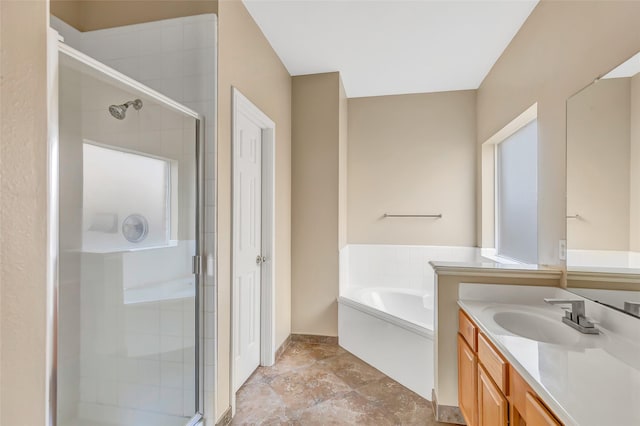 bathroom featuring vanity and shower with separate bathtub