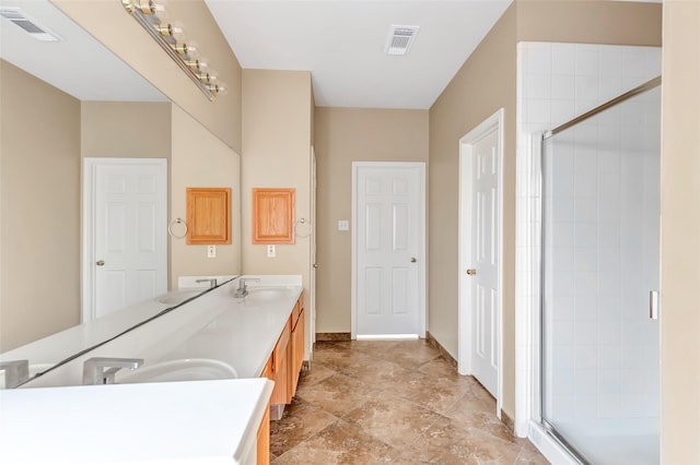 bathroom with an enclosed shower and vanity