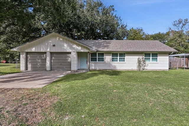 ranch-style house with a front yard and a garage