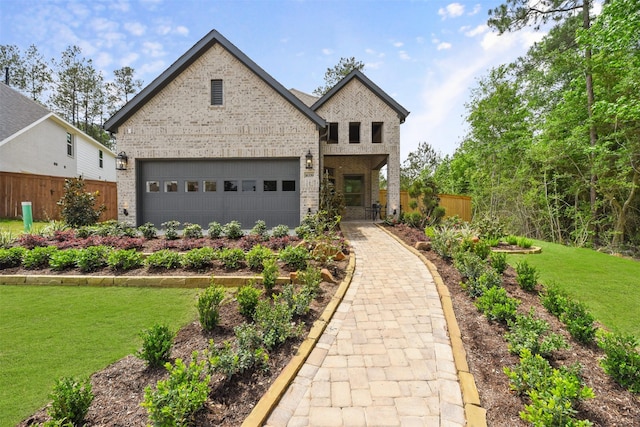 view of front of home with a garage and a front yard