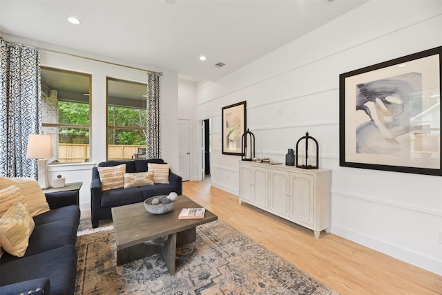 living room with light hardwood / wood-style flooring