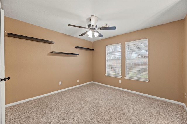 carpeted empty room with ceiling fan