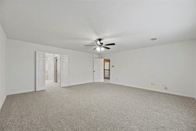 empty room with carpet floors and ceiling fan