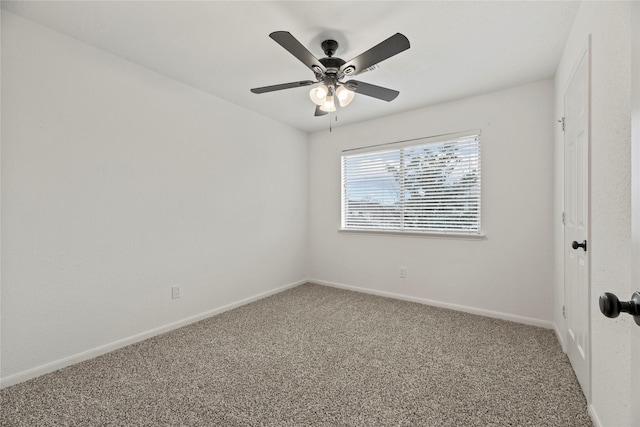 empty room with ceiling fan and carpet floors