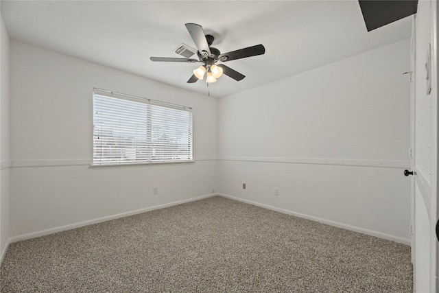 spare room featuring ceiling fan and carpet flooring