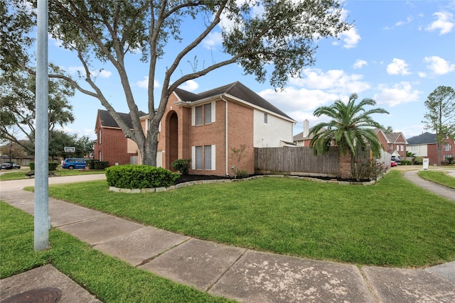 view of side of property with a yard