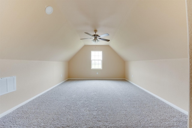 bonus room featuring ceiling fan, lofted ceiling, and carpet flooring