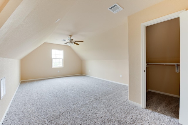 bonus room with ceiling fan, light colored carpet, and lofted ceiling