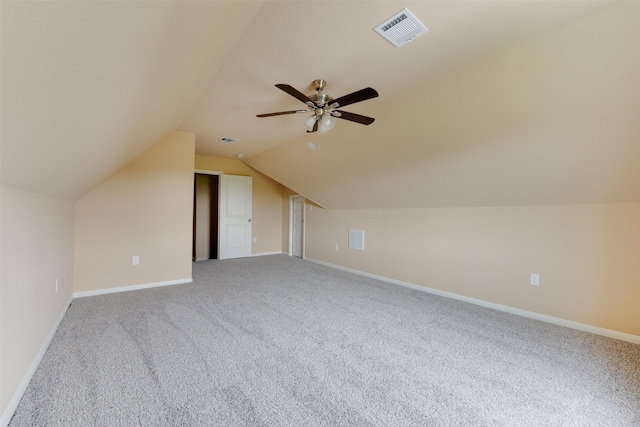 additional living space with ceiling fan, carpet, and vaulted ceiling