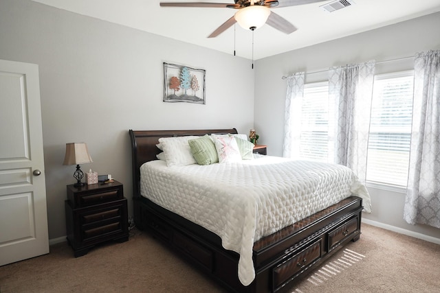 bedroom with light carpet and ceiling fan