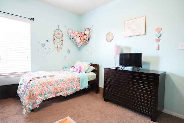 bedroom featuring light colored carpet