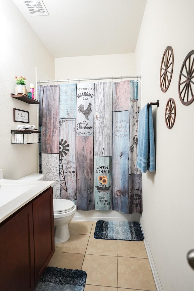 bathroom featuring tile patterned floors, toilet, vanity, and a shower with curtain