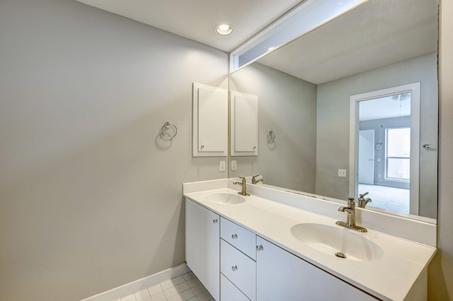 bathroom with tile patterned floors and vanity