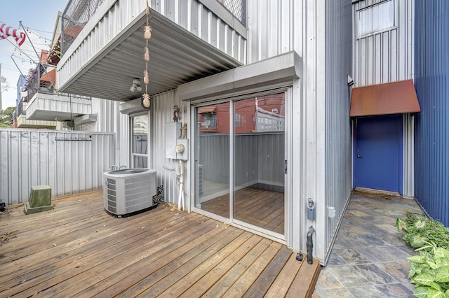 wooden deck with central air condition unit