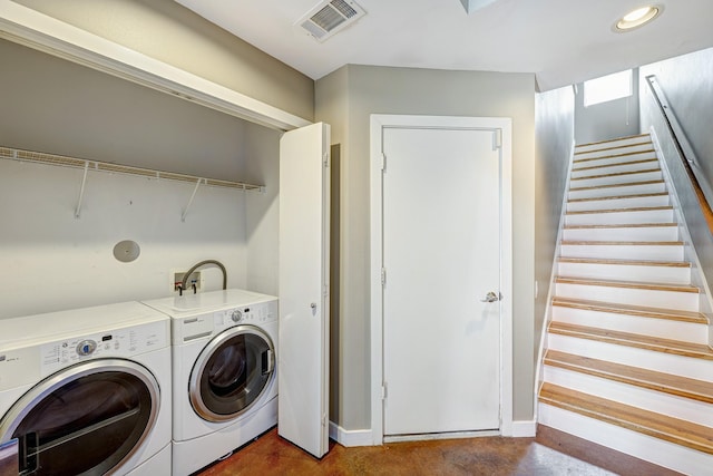 laundry area featuring independent washer and dryer